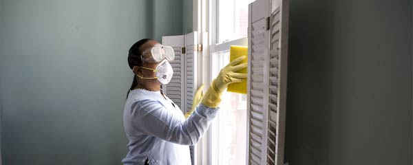 Woman cleaning windows